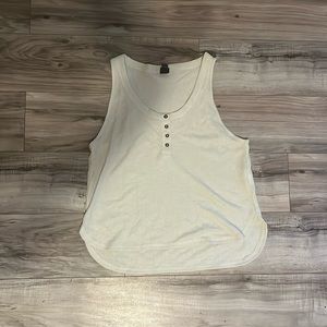 Size large cream colored and the brand is wild fable